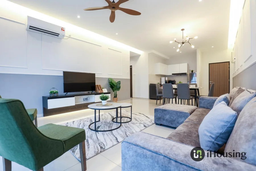 iHousing living and dining area with a blue sofa, green armchair and dining table
